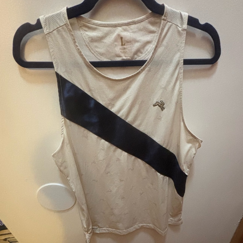 Tracksmith cream and navy Van Cortlandt singlet